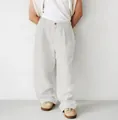 Detailed view of men's loose linen pleated joggers in off-white minimalist style - S / Bottoms / Light Gray