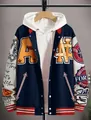 Close-up of a navy blue streetwear varsity jacket with cream sleeves and graphic prints - L / Tops / Navy Blue