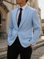 Gedetailleerde weergave van een lichtblauwe heren blazer met uniek zilveren glitterpatroon - S / Tops / Lichtblauw