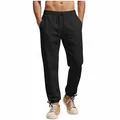 Detail view of men's black joggers featuring an elastic drawstring waist and ankle ties - S / Bottoms / Black