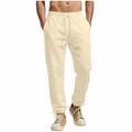 Detail view of men's cream-colored loose-fit sweatpants with drawstring and elasticated cuffs - S / Bottoms / Apricot