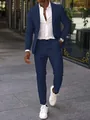 Full body detail of a navy blue slim fit men's formal business suit set with sneakers - S / Top And Bottom / Navy Blue