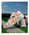 Detail showing the colorful flyknit texture and turf studs of white soccer shoes - 35 / White Orange Red Turf Spikes