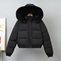 Elegant women's black short puffer jacket featuring a large plush faux fur collar - M / Tops / Black