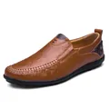 Detailed view of brown genuine leather casual loafers with intricate hand-stitched seams. - 37 / Brown