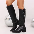 Detail view of stylish black knee-high boots with silver buckles and low block heel. - 35 / Black