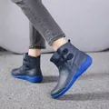 Side view of women's retro navy blue Martin boots with bright blue thick soles. - 38 / Blue