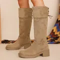 Detailed view of suede knee-high boots with chunky heel and lace-up back - 35 / Khaki