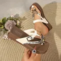 Close-up of brown and white platform wedge flip-flops with rhinestone butterfly bow - 36 / Milky White