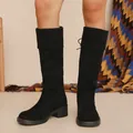 Front view of black suede knee-high boots with chunky heels and fold-over cuff - 38 / Black