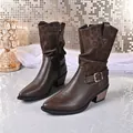 Detailed view of women's mid-calf leopard print boots with side zipper and chunky heel - 36 / Dark Brown