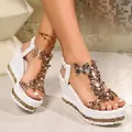 Elegant white wedge sandals with sparkling rhinestone straps and a platform sole - 35 / White Gold