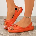 Fashionable orange chunky heel sandals featuring a rhinestone bow and slingback strap - Orange