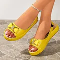 Stylish yellow platform sandals featuring rhinestone bow detail and slingback strap - 35 / Yellow