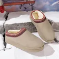 Cozy winter mule slippers with faux fur lining and ethnic embroidered trim set on snow. - 36 / Off White