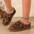 Close-up of leopard print mule slippers with colorful embroidered trim and warm faux fur lining - 36 / Leopard Print