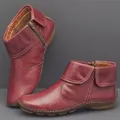 Détail montrant la fermeture éclair latérale et le col replié des bottes bordeaux - 35 / Bordeaux