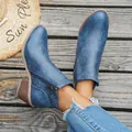 Blue distressed chunky heel ankle boots with laser-cut side details on model - 36 / Blue