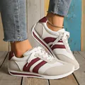 Close-up of white mesh women's sneakers with burgundy stripes on wood background - 35 / Gray Red