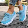 Detailed close-up of light blue mesh walking sneakers for women with flat white soles - Sky Blue