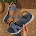 Detailed view of blue woven platform sandals with magic tape ankle strap for women. - Blue