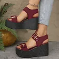 Detailed side view of burgundy fabric platform wedge sandals with elegant gold buckles - Burgundy
