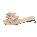 Elegant beige flat sandals for women featuring a large decorative fabric bow detail - 35 / Beige