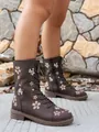 Detail shot of brown mid-calf boots with elegant floral embroidery in outdoor setting - 36 / Coffee