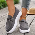 Close-up of women's grey platform loafers featuring metal buckles on a rustic wooden deck - 36 / Dark Gray