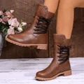 Detail of brown lace-up mid-calf boots with studded cuff and rustic background - 35 / Dark Brown