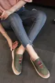 Close-up of green breathable flat shoes with colorful elastic gore and stylish laser-cut holes - 35 / Green