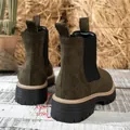 Macro view showing the 4.5cm platform thick sole on olive green suede Chelsea boots for women - 36 / Green