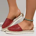 Detail view of red glitter flat platform sandals with open toe and tan ankle strap. - 38 / Red