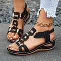 Stylish women's black peep toe wedge sandals featuring elegant metal buckle accents - Black