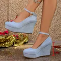 Light blue platform wedge heels featuring a 10cm heel and adjustable ankle strap. - Sky Blue