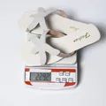 Lightweight women's summer beach sandals featuring a beaded starfish decoration in creamy white - 35 / Off White