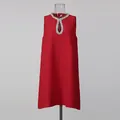 Detailed view of red shift dress featuring crystal-embellished keyhole neckline - S / Red