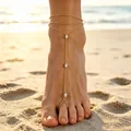 Elegant gold-finished barefoot sandal anklet with marquise crystals on a sunny beach. - 14k Gold Marquise Rhinestone Style (S373) / Gold