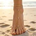 Elegant silver-toned foot jewelry with double-layered anklet and toe ring on sandy beach - White K Marquise Rhinestone Style (8884) / Silver