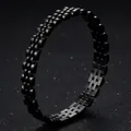 Close-up of black titanium steel watch-link style bracelet on textured background - Black