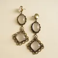Detailed view of vintage bronze earrings with clear resin oval and diamond-shaped charms - Silver Post Style (HE35673) / Gold White