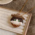 Detailed view of a handmade knitted cat pendant necklace with a brown cowboy hat - Kitten Pendant with Brown Cowboy Hat / Coffee Cord Style