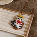 Detail shot of cute embroidered cat pendant necklace with yellow hat and red bow - Gray Striped Kitten Pendant with Yellow Beret / Coffee Cord with Gray Cat