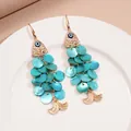 Vue détaillée des boucles d'oreilles poisson bohème en or avec œil bleu et disques en nacre. - 38# Style Crochet d'Oreille (Gland en Forme de Poisson Bleu Clair) / Bleu clair / 0.0