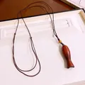 Handgemaakte houten vis hanger ketting met bruin gevlochten koord trui ketting. - Ovaal / Bruin