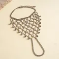 Detailed close-up of a silver geometric hollow hand chain bracelet with elegant tassels - Round Sunburst Style / Silver