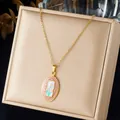 Close-up detail of a vintage French style enamel flower oval pendant gold-plated necklace - Oval Floral Style (N4594) / Gold