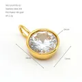 Detailed macro view of an 18K gold-plated stainless steel circular zircon pendant. - White