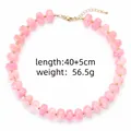 Detail van roze kralenketting met specificaties voor lengte 40+5cm en gewicht 56,5g - Roze
