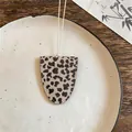 Leopard print leather oval glasses holder pendant necklace on a ceramic plate background - Beige Leopard